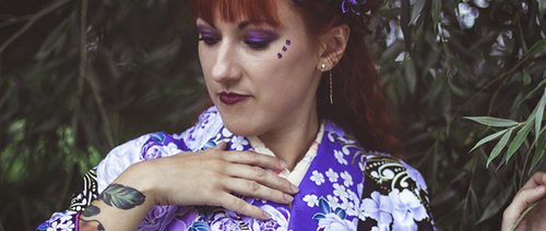 Young woman in purple floral traditional kimono